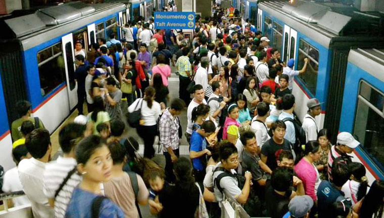 Crowded train station in the Philippines. Social distancing will need to be factored in public transport systems because of COVID-19. Image from PXFuel. 