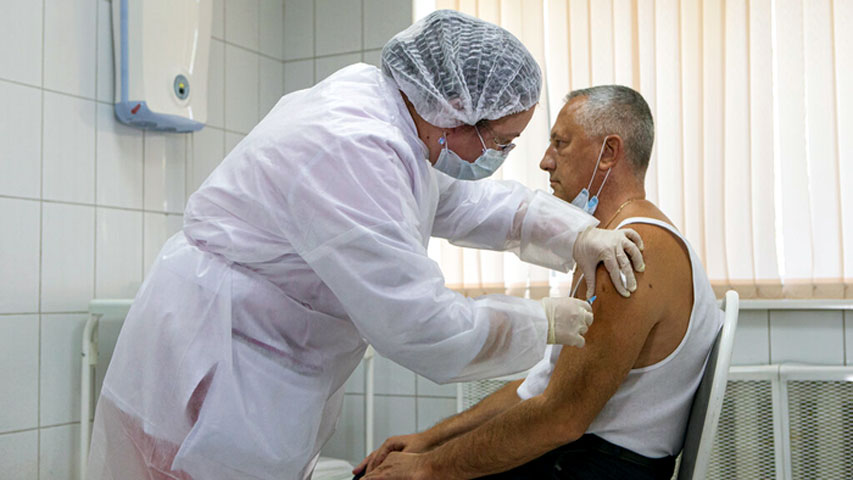 A Russian medical worker administers a shot of Russia's experimental Sputnik V coronavirus vaccine in Moscow, Russia. AP Photo