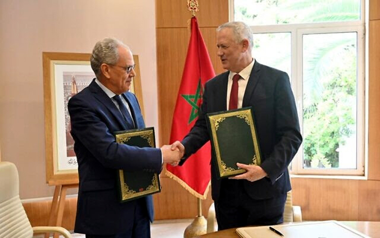 Defense Minister Benny Gantz, right, with his Moroccan counterpart Abdellatif Loudiyi, after signing a memorandum of understanding between the two countries at the Moroccan Defense Ministry in Rabat on November 24, 2021. (Defense Ministry)
 
