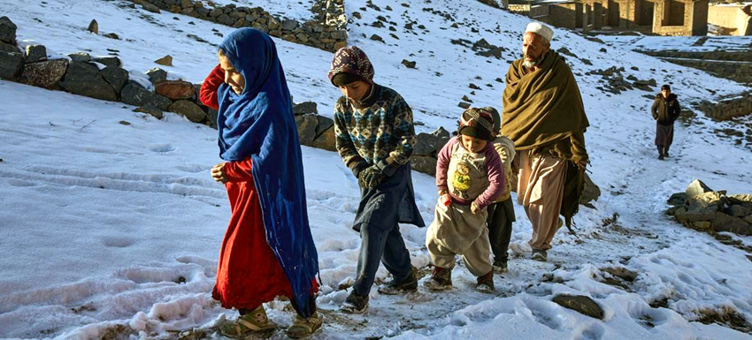File Photo: Displaced families collect water during a harsh winter in Kabul, Afghanistan.  Image: UNHCR/Andrew McConnell