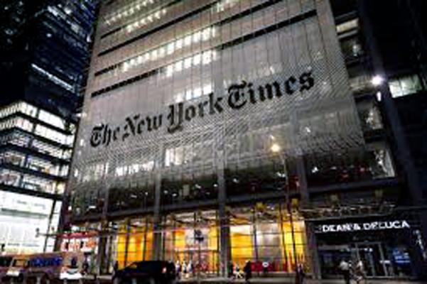 A sign for The New York Times hangs above the entrance to its building in New York. CNN.com