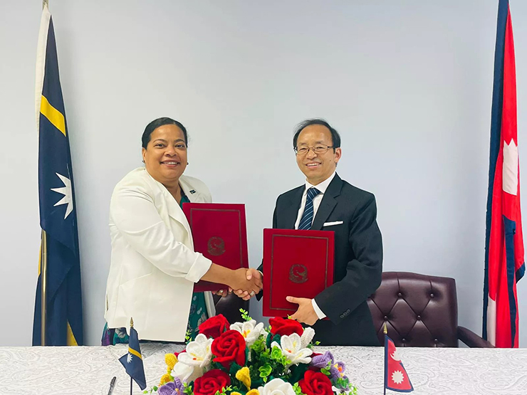 
The permanent representatives to the United Nations of Nepal and Nauru Amrit Rai and Ms. Margo Reminisse Deiye exchanging the documents after signed on it to established diplomatic relations between the two countries.
