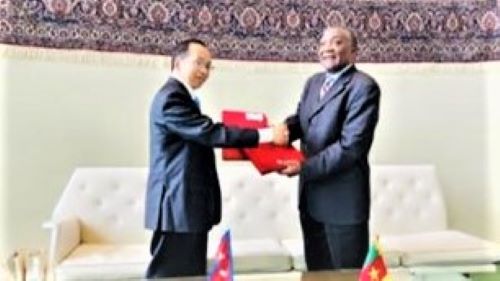 Permanent Representatives of Nepal and Cameroon at the United Nations H.E. Amrit Rai & H.E. Michel Tommo Monthe exchanging an agreement in New York today establishing diplomatic relations between the two countries.