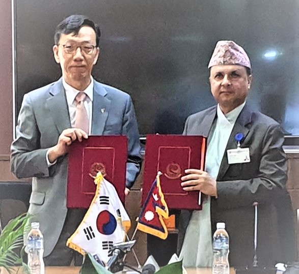 Secretary of Ministry of Finance Arjun Prasad Pokharel and Ambassador of the Embassy of the Republic of Korea in Nepal Park Tae-Young exchanging the signed documents.