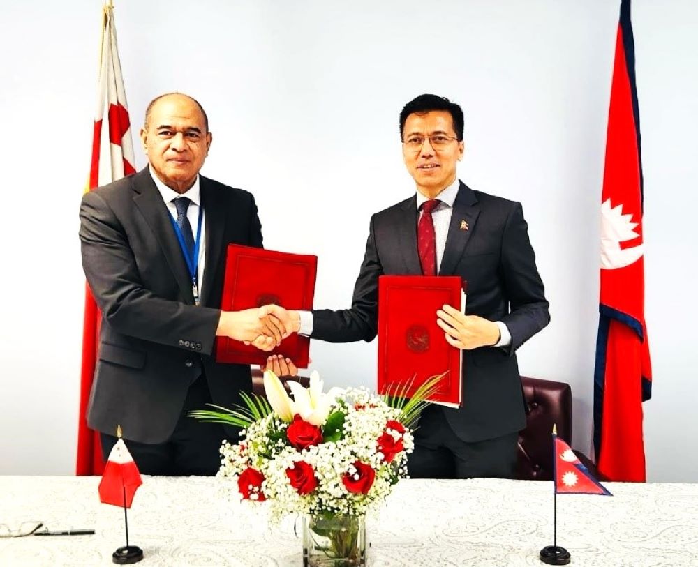 Permanent Representatives to the United Nations, Lok Bahadur Thapa and Viliami Va'inga Tone of Nepal and Tonga exchanging signed documents to establish diplomatic relations between two countries in New York, USA on March 1, 2024.