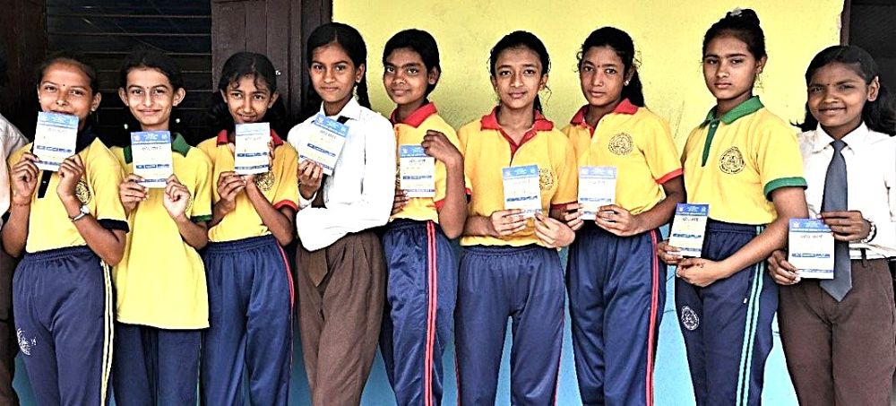 FILE: A group of students wait in line to get vaccinated against Measles-Rubella during the Outbreak Response Immunization campaign in Mahottari district of Madhesh Province. Photo credit WHO 