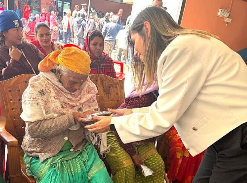 Deputy Chief of Mission of the Embassy of Israel Ms. Janan Bebar handing over the eyeglasses to the locals of Ghatichhina of Pokhara.