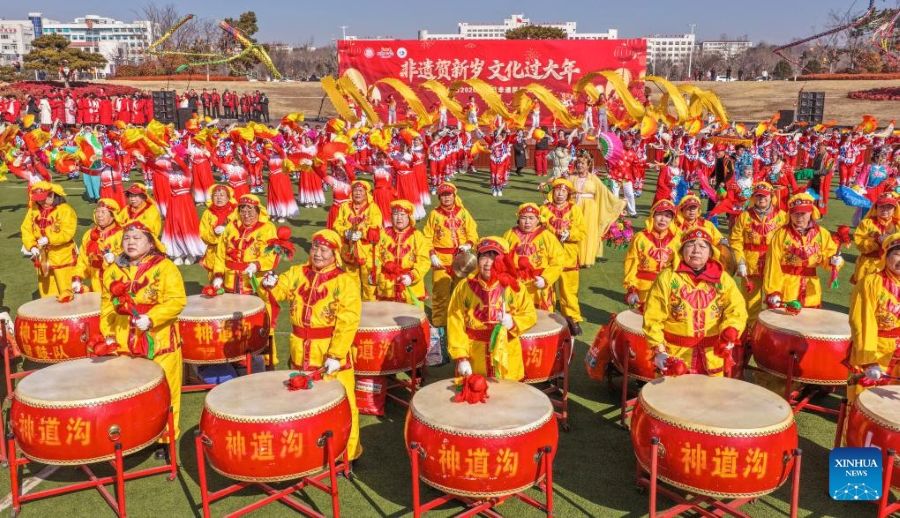 An aerial drone photo taken on Feb. 17, 2026 shows people staging folk performances in Rongcheng City of east China's Shandong Province. This year's Spring Festival saw a surge of visitors eager to experience local cuisine, rich history and vibrant folk performances. (Photo by Li Xinjun/Xinhua)