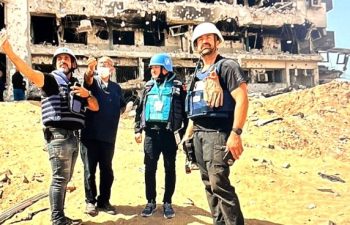 FILE PHOTO: UN staff with hospital director beside the ruins of the Al-Shifa Hospital in Gaza, April 2024. Image credit WHO