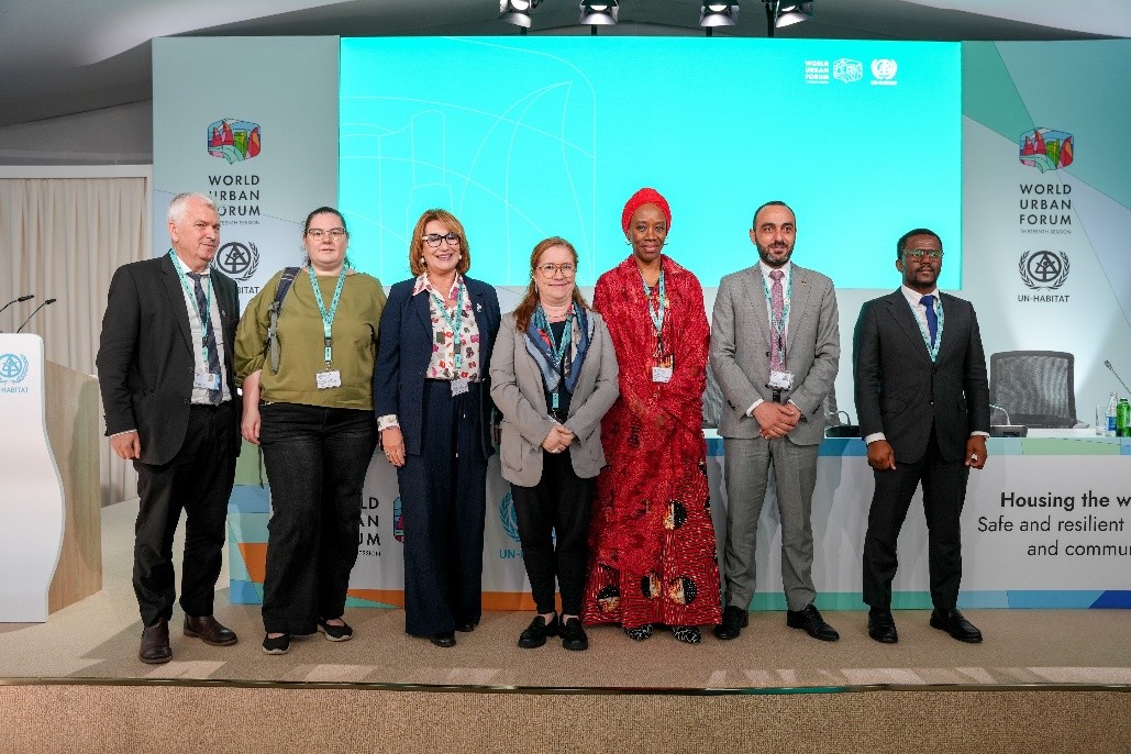 IOM Deputy Director General, Ugochi Daniels, with the panel members of session on Addressing internal displacement in devastated cities: Should housing and service provision take centre stage at the World Urban Forum. Photo: IOM 2026/Tatia Khubulava