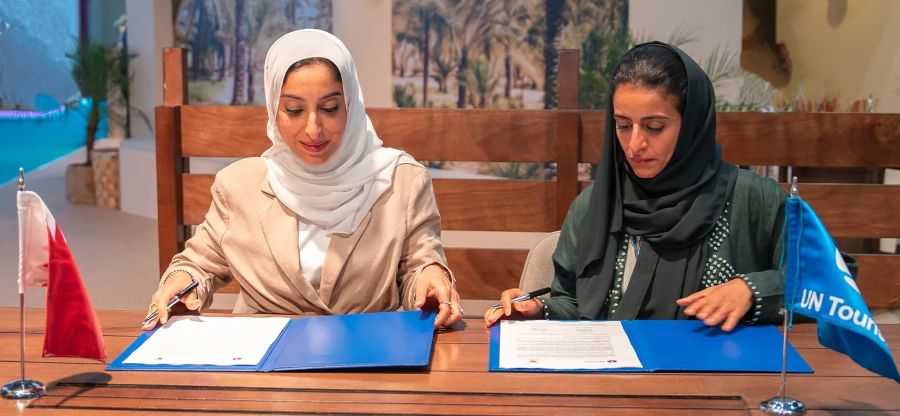 Minister of Tourism of Bahrain Her Excellency Fatima bint Jaafar Al Sairafi and Secretary-General of UN Tourism Her Excellency Shaikha Nasser Al Nuwais signing the agreement at the Arabian Travel Market 2026 in Dubai. UN Tourism Photo