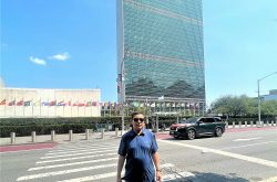 The writer is in front of the United Nations building in New York where the 81st General Assembly session begins today.