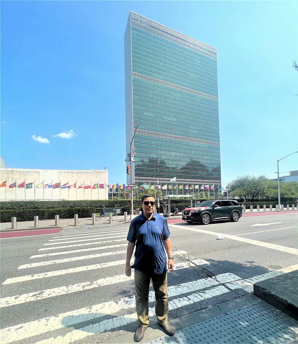 The writer is in front of the United Nations building in New York where the 81st General Assembly session begins today.